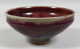 A CHINESE FLAMBE GLAZE POTTERY BOWL. 18cm diameter