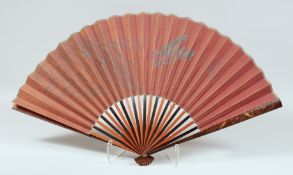 A JAPANESE LACQUERED WOOD FOLDING FAN, the lacquered guards decorated with carp and insects.