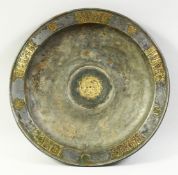AN UNUSUAL LARGE ISLAMIC PEWTER DISH, with inlaid brass panels with engraved decoration, the