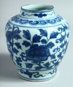 A CHINESE BLUE AND WHITE PORCELAIN JAR, decorated with beast and flower heads, 16cm high.