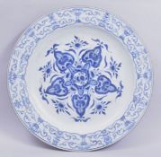 A VERY LARGE CHINESE BLUE AND WHITE PORCELAIN DISH, the centre painted with a stylised floral motif,