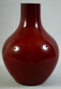 A LARGE CHINESE SANG DE BOEUF GLAZE VASE, 32.5cm high.