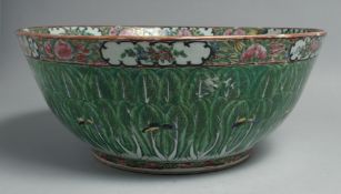 A LARGE CHINESE CANTON FAMILLE VERTE PORCELAIN PUNCH BOWL, painted with leaves and butterflies, 36cm