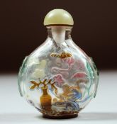 A SUPERB CHINESE ROCK CRYSTAL SNUFF BOTTLE AND JADE STOPPER, with carved and stained decoration