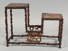 A CHINESE 19TH CENTURY HARDWOOD TWO TIER STAND, possibly huanghuali, 30cm wide at the base.