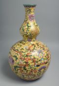 A LARGE CHINESE FAMILLE JAUNE DOUBLE GOURD PORCELAIN VASE, the body painted with famille rose
