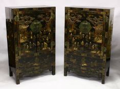 A PAIR OF CHINESE BLACK LACQUER HARDWOOD CABINETS, the hinged doors opening to reveal a central