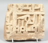 A 13TH / 14TH CENTURY PERSIAN ILKHANID TILE with early Kufic calligraphy, 15.5cm x 14cm.