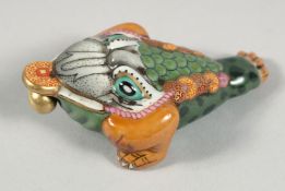 A CHINESE AQUATIC BEAST FORMED PORCELAIN SNUFF BOTTLE AND STOPPER, the base with four-character