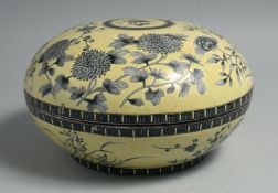 A LARGE CHINESE FAMILLE JAUNE PORCELAIN CIRCULAR BOX AND COVER, decorated with various native flora,