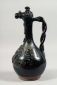 A 19TH CENTURY OTTOMAN CANAKKALE GLAZED POTTERY EWER, with twist handle and painted flora to the