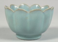 A SMALL CHINESE CELADON PETAL-SHAPED BOWL, 10.5cm diameter