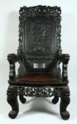 A LARGE CHINESE CARVED ROSEWOOD THRONE / ARMCHAIR, the cresting rail with carved and pierced