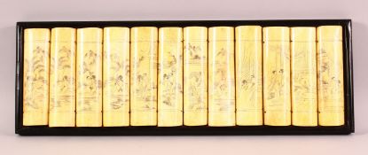 A CHINESE CARVED & STAINED BONE EROTIC PANEL - the panel simulating 12 book ends , each section