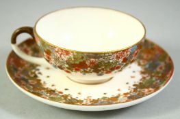 A SMALL JAPANESE SATSUMA CUP AND SAUCER, finely decorated with flowers and butterflies, each piece