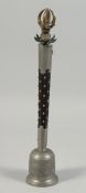 A TIBETAN BELL WITH STUDDED HARDWOOD HANDLE, the handle end with brass lotus and vajra, 39.5cm