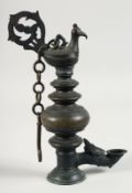 AN INDIAN BRONZE TEMPLE OIL LAMP, 27cm high.