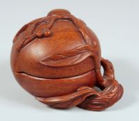 A CHINESE CARVED HARDWOOD PEACH FORM BOX AND COVER, with carved and pierced branch to the base, 13cm