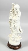 A 20TH CENTURY CHINESE BLANC-DE-CHINE FIGURE OF SHOU-LAO mounted to a fitted hardwood stand. 34.