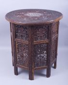 A GOOD MOORISH BONE INLAID CIRCULAR TABLE, carved with two bands of grape and vine and ornate