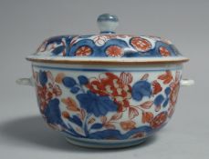 A JAPANESE IMARI PORCELAIN BOWL AND COVER, with floral decoration, 13cm diameter.