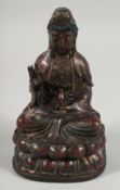 A BRONZE FIGURE OF A SEATED BUDDHA, holding a small vile in his left hand and sat upon a lotus base,