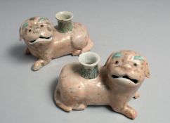 A PAIR OF 19TH CENTURY CHINESE CANTON PORCELAIN FOO DOG CANDLESTICK HOLDERS, each 13cm long.