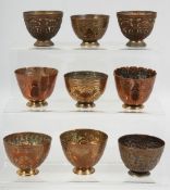 NINE 18TH/19TH CENTURY TURKISH OTTOMAN TOMBAK ZARF CUPS, each approx. 5.5cm diameter, (9).
