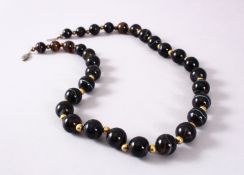 A GOOD SET OF VICTORIAN CARVED AGATE ROSARY BEADS, in Mont Blanc style colours, dark brown to