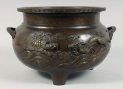 A LARGE JAPANESE BRONZE TWIN HANDLE TRIPOD CENSER, with relief decoration depicting a dragon and