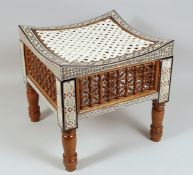 A 20TH CENTURY EGYPTIAN MOTHER OF PEARL INLAID SQUARE FORM WOODEN STOOL, the sides with mashrabiya