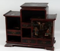 A 19TH CENTURY CHINESE LACQUERED WOOD CABINET, comprising two doors and three drawers, 50cm high,