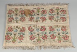 AN 18TH CENTURY TURKISH OTTOMAN EMBROIDERED TEXTILE, embroidered with floral motifs, 136cm x 44cm.