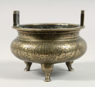 A CHINESE GILT BRONZE TWIN HANDLE TRIPOD CENSER, with engraved decoration, the base with six-