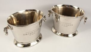 A PAIR OF OVAL TWO HANDLED CHAMPAGNE WINE COOLERS. 12ins diameter.