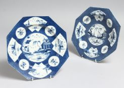A PAIR OF WORCESTER POWDER BLUE OCTAGONAL PLATES with Chinese vignettes. 7.5ins diameter. Rous Lench