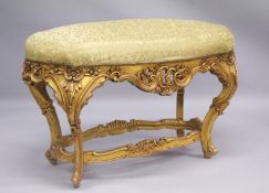 A GOOD LARGE FRENCH GILTWOOD OVAL STOOL with padded top. 41ins long.