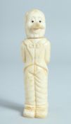 A CARVED BONE CORKSCREW, man with long nose. 5ins high.
