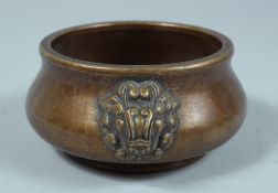 A CHINESE BRONZE CIRCULAR CENSER with lion handles. 4ins diameter.