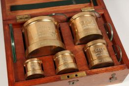 THE COUNTY BOROUGH OF HUDDERSFIELD. A SET OF SIX BRASS MEASURES, pint to a 1/4 gill, in a