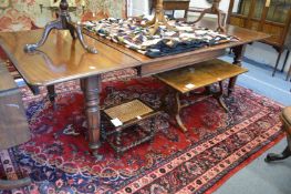 A GOOD 19TH CENTURY MAHOGANY EXTENDING DINING TABLE with two leaves on turned and carved supports.