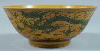 A LARGE CHINESE FAMILLE JAUNE CIRCULAR BOWL (A/F). 7ins diameter.