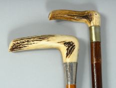 TWO GOOD VICTORIAN WALKING STICKS with bone handles and silver bands. 35ins long.