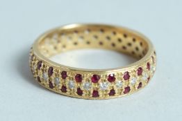 AN 18CT GOLD, RUBY AND DIAMOND RING.