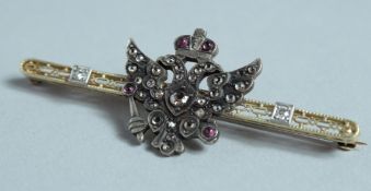 A GOOD 14CT GOLD, DIAMOND SET RUSSIAN EAGLE BAR BROOCH. Faberge mark.