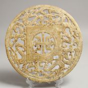 A CHINESE PIERCED JADE CIRCULAR DISH. 9.5ins diameter.