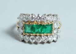 A GOOD DIAMOND AND EMERALD RING.