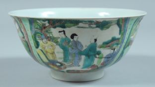 A CHINESE BOWL decorated with panels of figures. 6ins diameter.