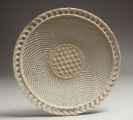 A GOOD BELLEEK PIERCED LATTICE WORK CIRCULAR PLATE. 10ins diameter.