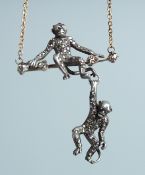 A RUSSIAN FABERGE DIAMOND SET MONKEY PENDANT in a Faberge box.